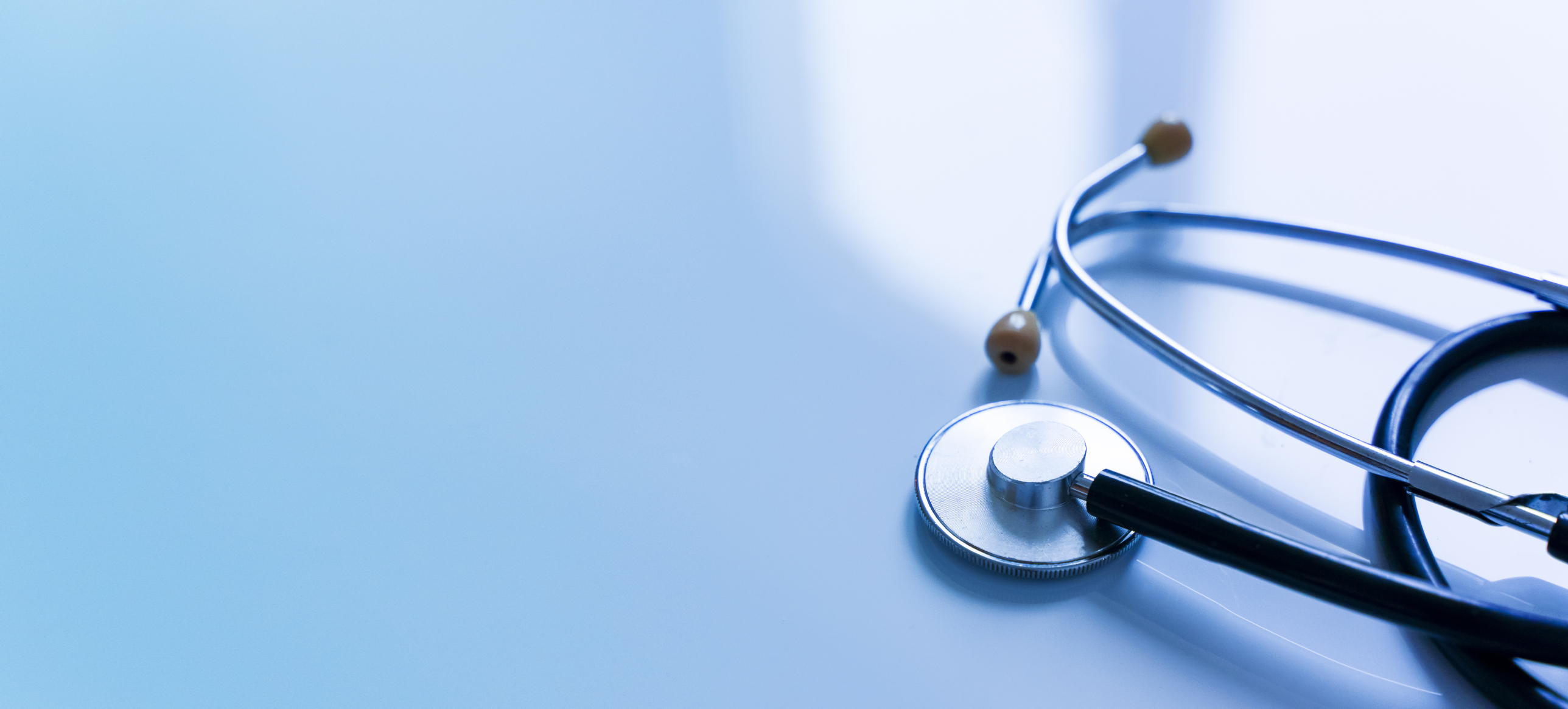 Stethoscope on blue background