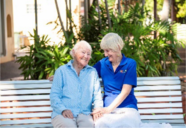 Old couple sitting next to each other